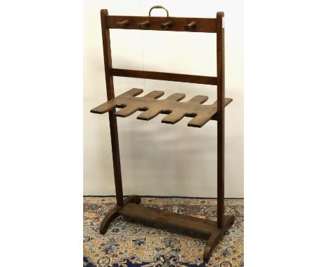 Early C20th whip and boot rack, for eight boots, mahogany frame with brass handle, W53cm D35cm H100cm 