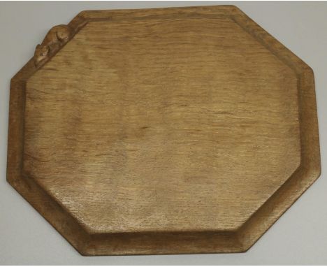 Robert Mouseman Thompson of Kilburn - an oak elongated octagonal bread board, carved with signature Mouse, W31cm D25cm 