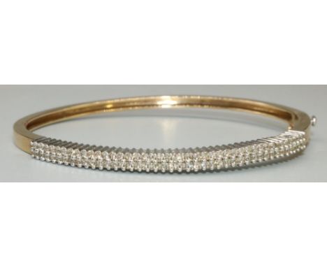 9ct yellow gold bangle set with brilliant cut diamonds, with box clasp closure, stamped 375, 12.3g 