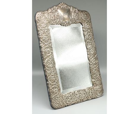 Large Victorian style hallmarked silver easel mirror, relief decorated with scrolls and foliage and with vacant cartouche, by