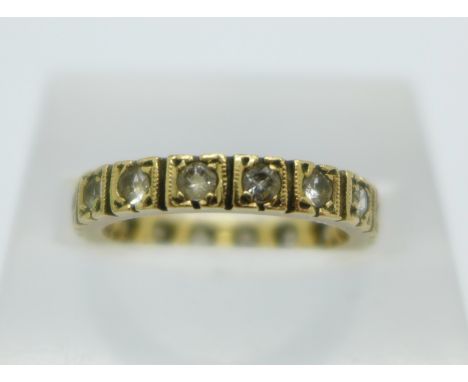 A 9ct gold and stone set eternity ring, 2.7g, K