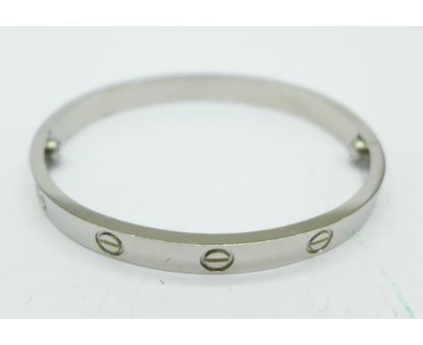 An 18ct white gold Cartier bangle, marked 750, 16, Cartier, IP1314, 18.8g, (no screwdriver)