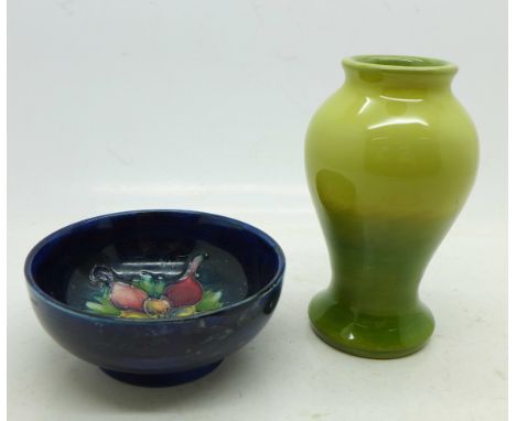 A small Moorcroft bowl, rim restored and a green Moorcroft vase (2), vase 9.5cm