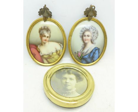A pair of miniatures in gilt frames, a framed circular portrait and a photograph frame