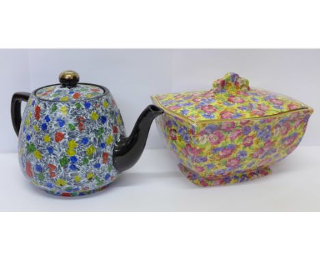 A chintz lidded dish and a teapot, small chip to the spout