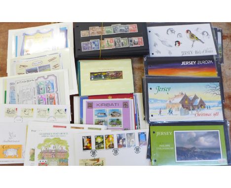 A collection of foreign and commonwealth miniature stamp sheets, stamp presentation packs, Channel Islands first day covers a