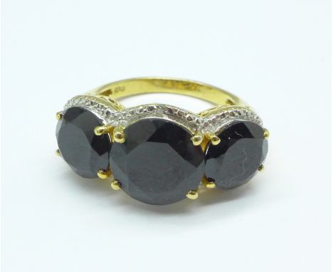 A large silver gilt stone set ring, R