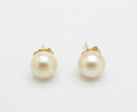 A pair of 14ct gold and pearl earrings