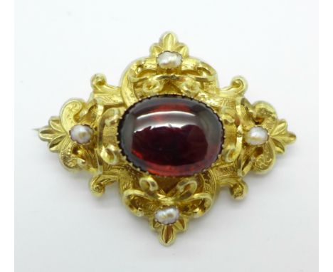 A Victorian gold, cabochon garnet and pearl brooch, tests as 15/18ct gold