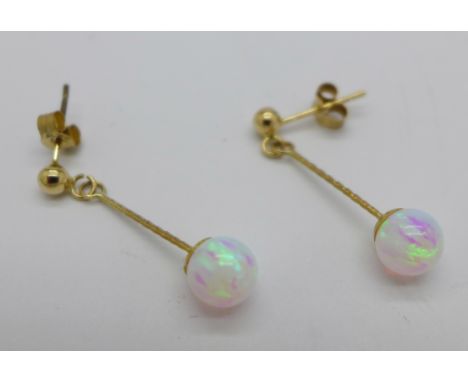 A pair of yellow metal and opal earrings, fasteners marked 375