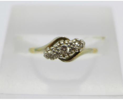 An 18ct gold, platinum set three stone diamond ring, 1.8g, K