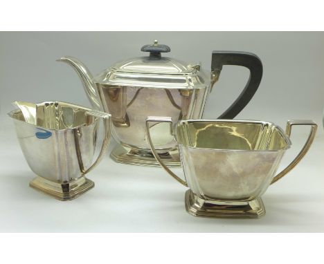 An Art Deco three piece silver tea service, 984g, Sheffield 1940