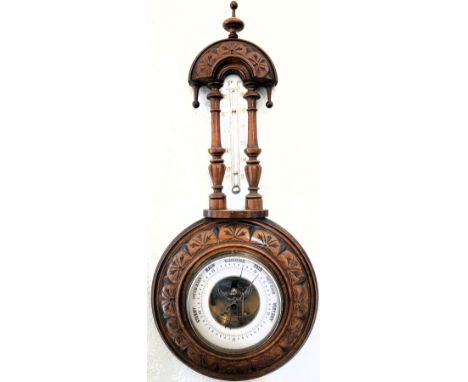 Mahogany and enamelled wall mounting early 20th century  aneroid barometer. Approx. 50 x 23cms
reasonable used condition not 