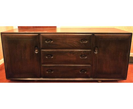 Ercol mid 20th century sideboard. Approx. 67 x 156 x 45cms
reasonable used condition with minor scuffs scratches etc drawers 