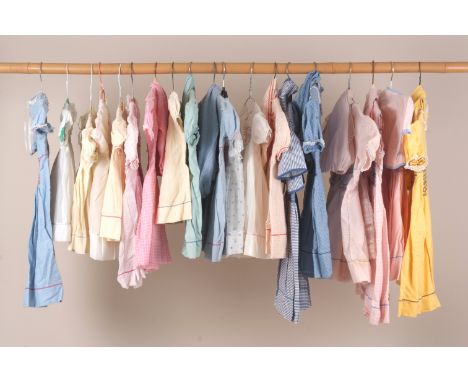 A QUANTITY OF VINTAGE SMOCKED CHILDREN'S DRESSES A collection of 1950's children's cotton hand smocked dresses, most of the d