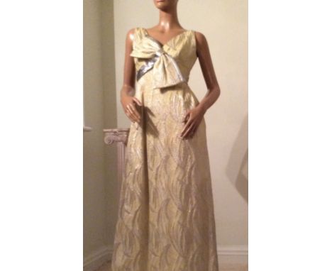 A COLLECTION OF 1960'S TINSEL LAME EVENING GOWNS One with V-back and bow detail, one designer label "Hanae Mori" tinsel lame 