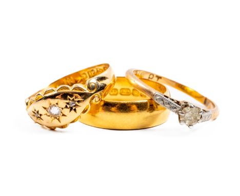 THREE GOLD RINGS (3)Comprising: a 22ct gold wide band wedding ring, London 1965, ring size K½, weight 4.9 grams, an 18ct gold