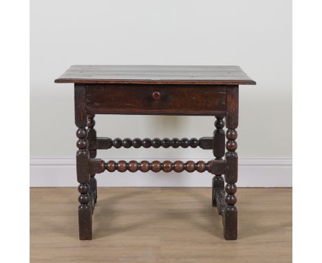 AN 18TH CENTURY OAK SINGLE DRAWER SIDE TABLEOn bobbin turned supports, 77cm wide; 50cm deep; 64cm highOld marks and scratches