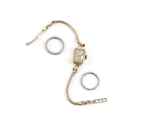TWO ETERNITY RINGS AND A LADY'S WRISTWATCH (3)Comprising; a ruby eternity ring, mounted with square cut rubies, ring size M½,