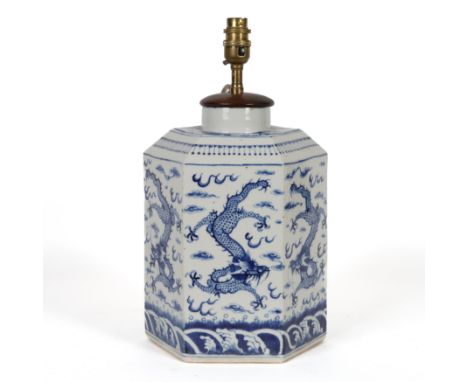 A CHINESE BLUE AND WHITE HEXAGONAL URN OR STORAGE JAR ADAPTED AS A TABLE LAMP20th Century
Decorated with dragons, 38cm high i
