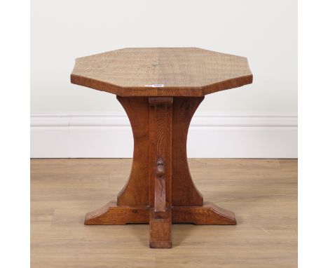 ROBERT MOUSEMAN THOMPSON OF KILBURN; AN OAK ADZED TOPPED OCTAGONAL OCCASIONAL TABLEOn four concave supports, 57cm wide; 47cm 