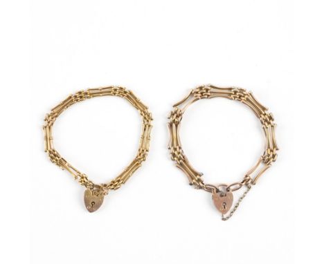 TWO GOLD GATE LINK BRACELETS (2)Of varying bar and oval link design, each having a heart shaped padlock clasp, detailed 9 CT,