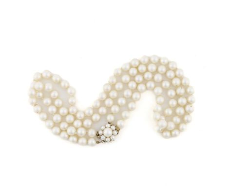 AN 18CT GOLD PENDANT DESIGNED AS A LETTER J AND A TWO ROW CULTURED PEARL NECKLACE (2)The pendant mounted with small single cu
