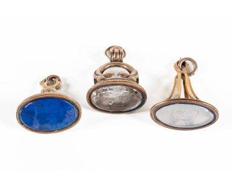 THREE EARLY 19TH CENTURY PENDANT FOB SEALS (3)Comprising: a lapis lazuli seal, unengraved, a chalcedony seal, monogram engrav