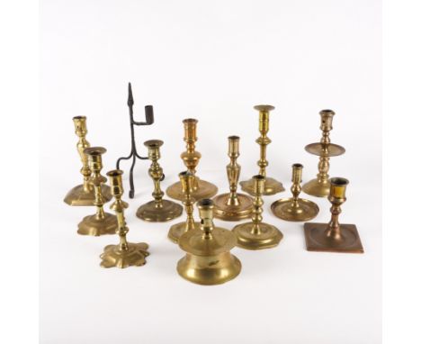 A GROUP OF THIRTEEN EUROPEAN AND ENGLISH BRASS CANDELSTICKS (14)Including a 'Capstan' candlestick, with rectangular ejection 