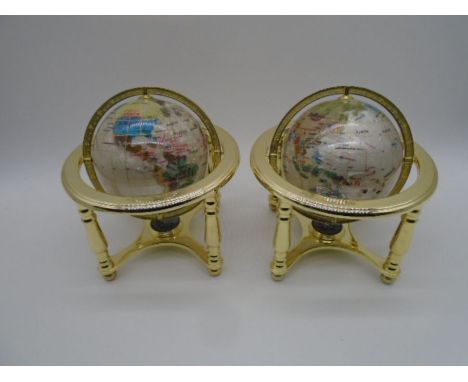 A pair of small gemstone globes with brass supports and compass under - height approx. 25cm
