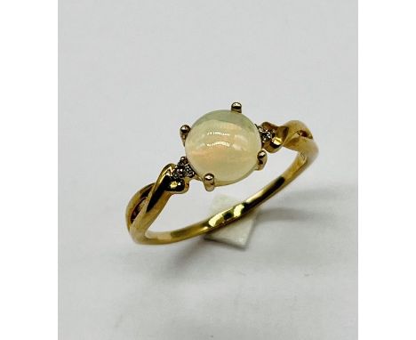 A 9ct gold and opal ring