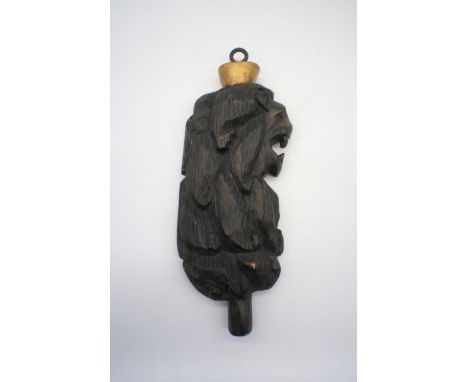A carved wooden lion's head from a ship with ring to top and 'PORT' impressed to reverse, length 47cm.