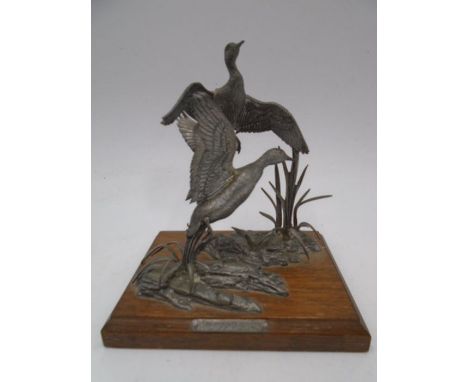 An A R Brown pewter sculpture of Mallards in reeds, mounted on oak base, height approx. 14cm