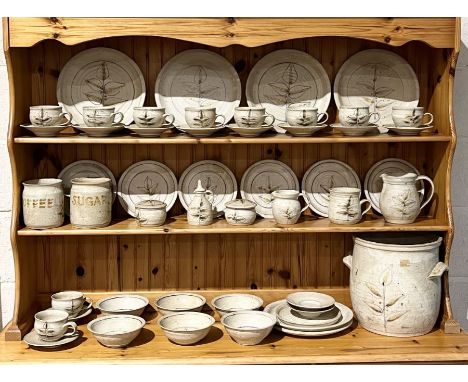 A large studio pottery part dinner service made as a commission piece by Mike Fletcher, including dinner plates, cups, saucer