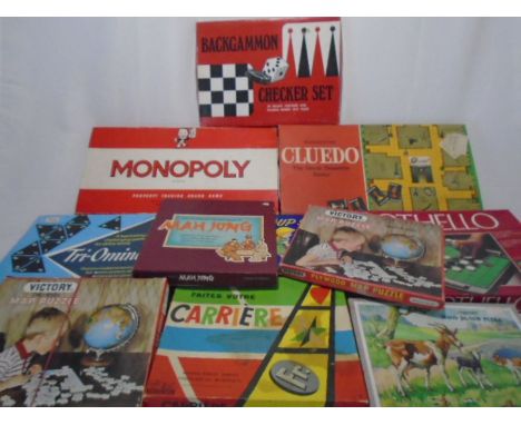 A collection of classic board games and jigsaw puzzles including Monopoly, Othello, Cluedo, Tri-omino's, Mah Jong, Back Gammo