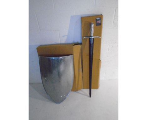 A Southern Swords cold steel sword with scabbard, along with plain steel re-enactment shield.