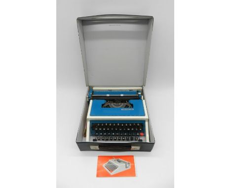 A vintage boxed Underwood 315 typewriter with instruction manual.