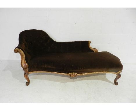 A Victorian button-back chaise longue with carved rosewood frame, length 180cm.