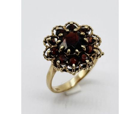 A 9ct gold garnet cluster ring, total weight 4.3g