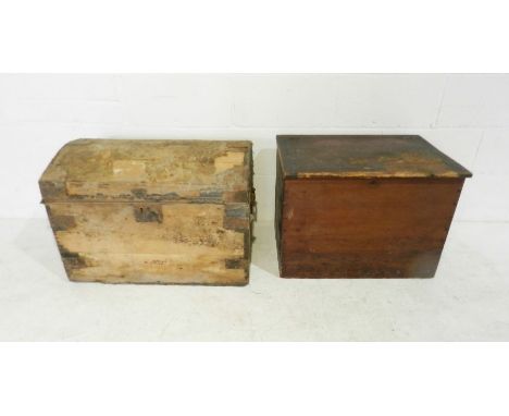 A stained pine trunk along with a domed top trunk.