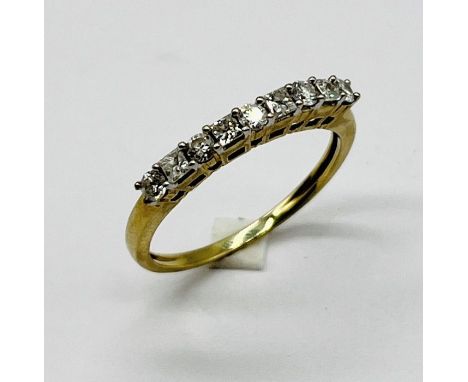 A diamond 9 stone half eternity ring set in 9ct gold