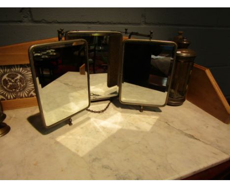 A triptych early 20th Century free-standing mirror, bevel edged glass, foliate design