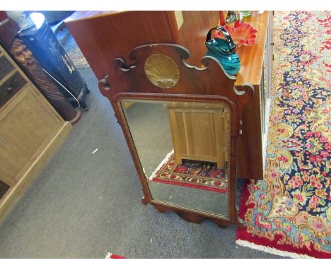 A Regency mahogany fretwork wall mirror with carved gilt motif, bevelled glass and gilt border, 105cm x 60cm overall         