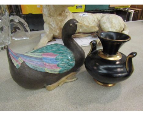 A Luxembourg vase and ceramic duck figure