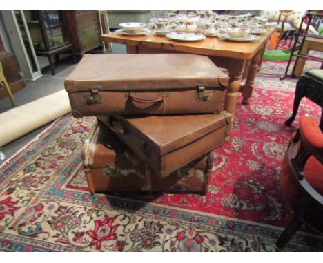 A vintage wooden bound trunk and two suitcases