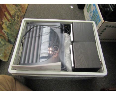 A Steepletone SMC1033 6-in-1 music system with instruction manual