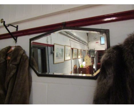 An early 20th Century Deco metal framed mirror, mirror plate deteriorating, 42cm x 69cm