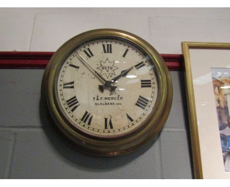 T. &amp; F. Mercer, St Albans brass electric wall clock with Roman numerals.  Painted face has peeling