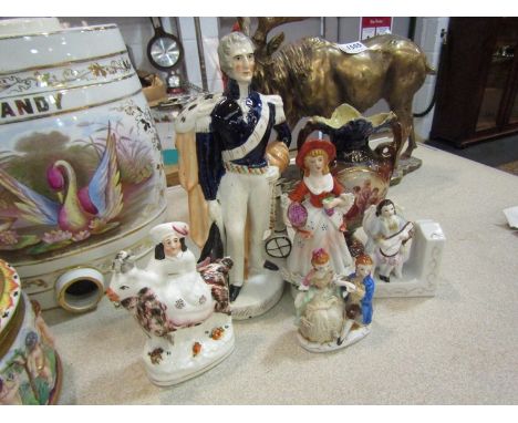 A quantity of figures including Staffordshire Wellington &amp; Maiden