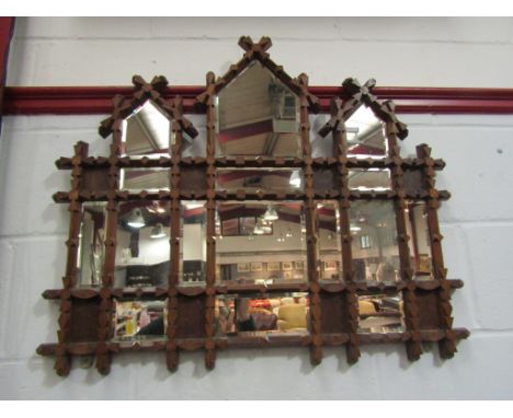 A Black Forest influence wall mirror